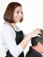 smiling woman Hairdresser doing head massage to man customer