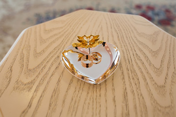 Gold wedding rings on the stand for rings