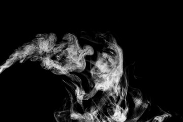 Obraz na płótnie Canvas White smoke isolated on black background.