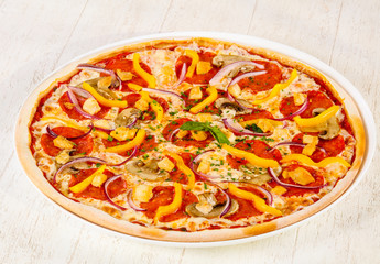 Pizza with salami and mushrooms