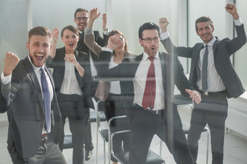 happy business team sitting in conference room.