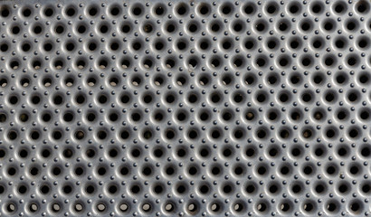 Perforated and shiny metal sheet