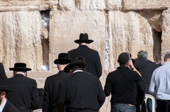 Jewish mens pray at Western Wall in Jerusalem
