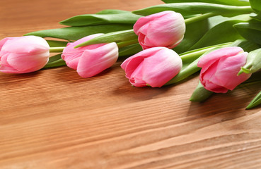 tulips on a wooden table