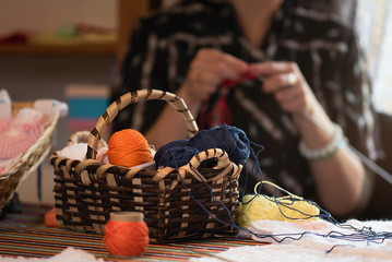 Close up of hands crocheting with wool,knitting handicraft hobby homemade