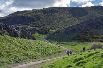 A hillwalking route through grassy slopes up to Arthur’s Seat, the highest point in Edinburgh located at Holyrood Park, Scotland, UK