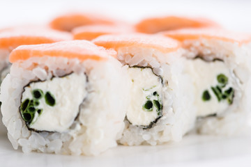 Sushi set and composition at white background. Japanese food restaurant, sushi maki gunkan roll plate or platter set.