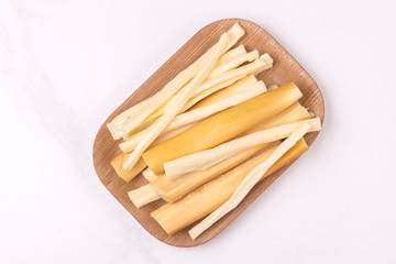 Healthy Snack. Smoked string cheese. Kobarcik. Selective focus