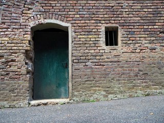 Green door in a brick house