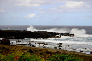 Reunion island seascape, landscape. Black sand, volcanic rocks.