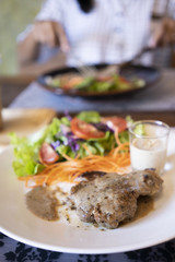 Steak and Salad in Plate.