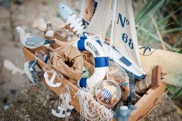 typical symbols and elements of beach, sea, nature, sailing, outdoor, vacation in a wooden box