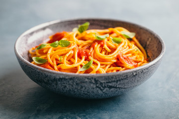 Italian pasta with tomato sauce in bowl