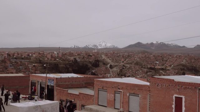 LA PAZ, BOLIVIA - CIRCA 2017: Zoom out Panoramic view of the brick houses and buildings in the neighborhood of El alto, Bolivia. Aerial view4k 