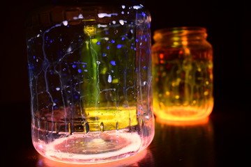 Colored cans at night, luminaire from cans