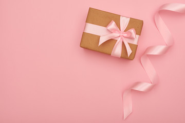 Little wrapped handmade present box placing at right corner