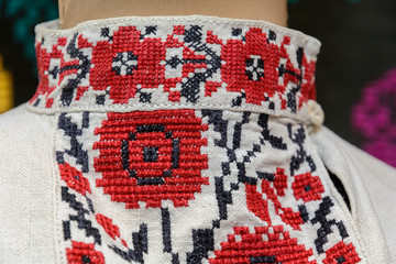 Fragment of an ancient authentic embroidery on a man's shirt.