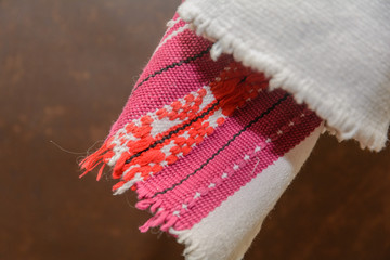 A fragment of an ancient authentic fabric of a woven towel from a village in Polissya. Belarus