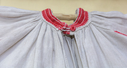 Fragment of an ancient authentic embroidery on the collar of a woman's shirt.