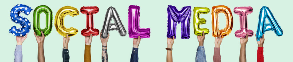 Hands showing social media balloons word