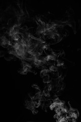 White smoke isolated on black background.