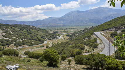Fototapeta na wymiar Greece. Crete. Pass Seli-Ambelu. Serpentine towards the Lassithi Plateau