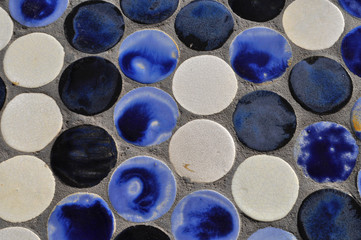 round tiles in concrete pavement background