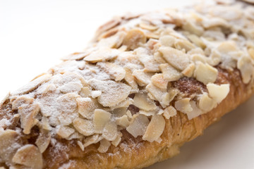 Almond croissant  filled with almond cream and topped with sliced almonds