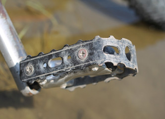 close photo of a foot pedal of mountain bike