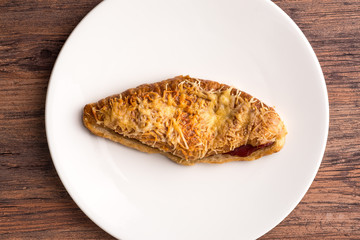 croissant ham cheese on white plate