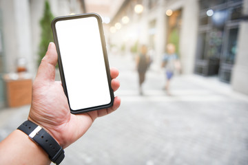 Man holding smart phone with blurred background