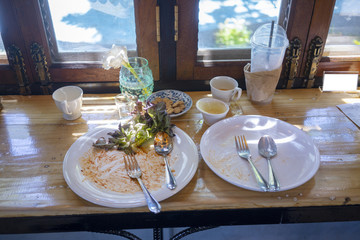 The food stains on the white plate after eating.