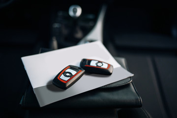 Keys and documents inside car interior