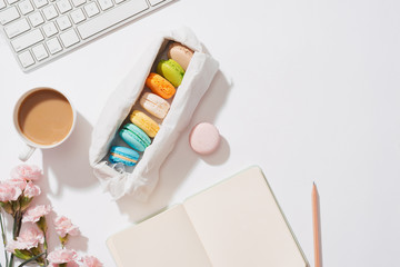 Cozy morning breakfast with pastel colorful macarons or macaroons.