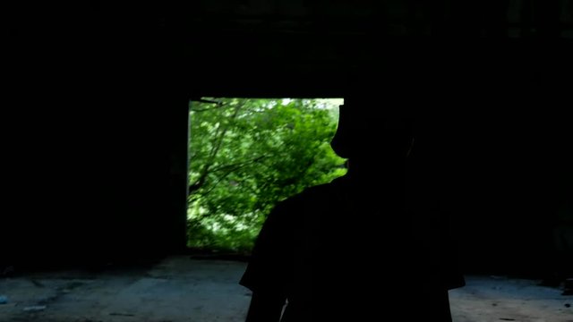 Stranger explores old dark abandoned garage in jungle