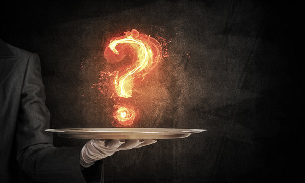 Hand of waitress presenting flaming question mark - Powered by Adobe