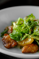  salad with chicken steak, salad mix, orange, cheese. Under the olive oil.