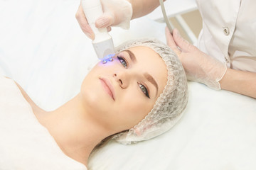 Obraz na płótnie Canvas Dermatology treatment in cosmetology clinic. Woman and doctor. Skin procedure