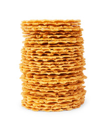 A stack of thin, crispy, round wafers on a white background