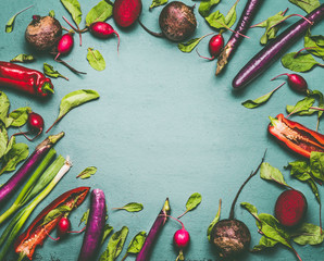 Various vegetables on blue green background , frame, top view, flat lay. Healthy vegetarian and...