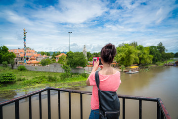 Woman traveler traveling walking with backpack at the  jungle on holiday at weekend on background nature view