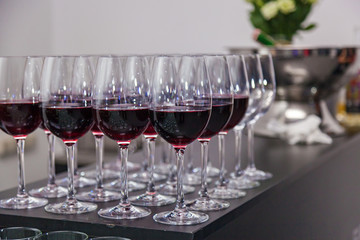 glass glasses with red wine on the bar, shallow depth of field