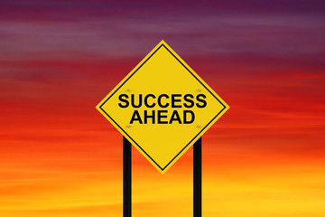 Success ahead road sign with sky