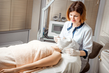 Woman having peeling in spa salon. Procedure, mask