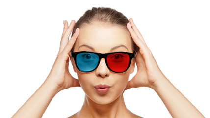 Fototapeta premium face expressions and people concept - portrait of excited young woman or teenage girl in red blue 3d glasses