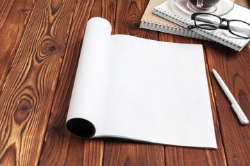 Open blank journal pages for your design copy space on wooden background
