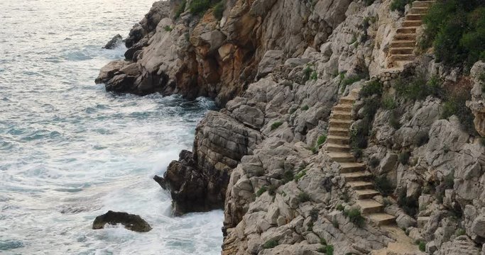 Stone Stairs On The Rock To The Mediterranean Sea in Saint Jean Cap Ferrat, French Riviera, France - 4K Video
