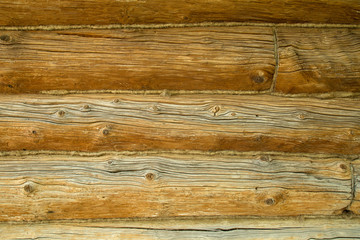 fragment of a wall of an old wooden logs