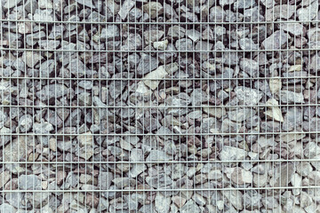 Fototapeta premium fence from the pieces of granite and metallic grates