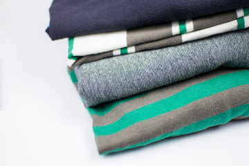 A stack of colorful sweaters.